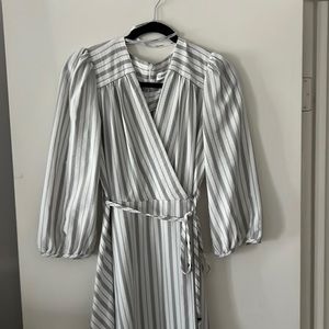 Women’s gray Striped peplum style dress.